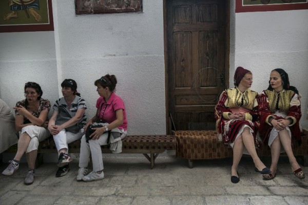 Galichnik, Macedonia-- Women sit in the church to attend the wedding ceremony during the annual wedding festival in the Macedonian town of Galichnik. The festival is a chance for the decedents of villagers to reenact folk wedding traditions in this depopulated region. Currently the village has only two year-round residents, although it is a popular summer vacation spot. Photo by Jodi Hilton/NurPhoto PHOTO BY JODI HILTON (Photo by Jodi Hilton/NurPhoto)